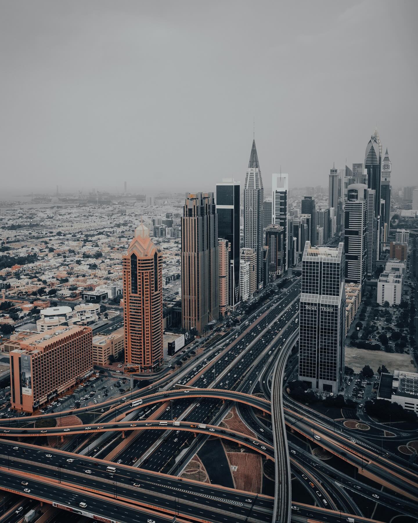 Captivating city lights dance below as traffic weaves through the urban tapestry.
